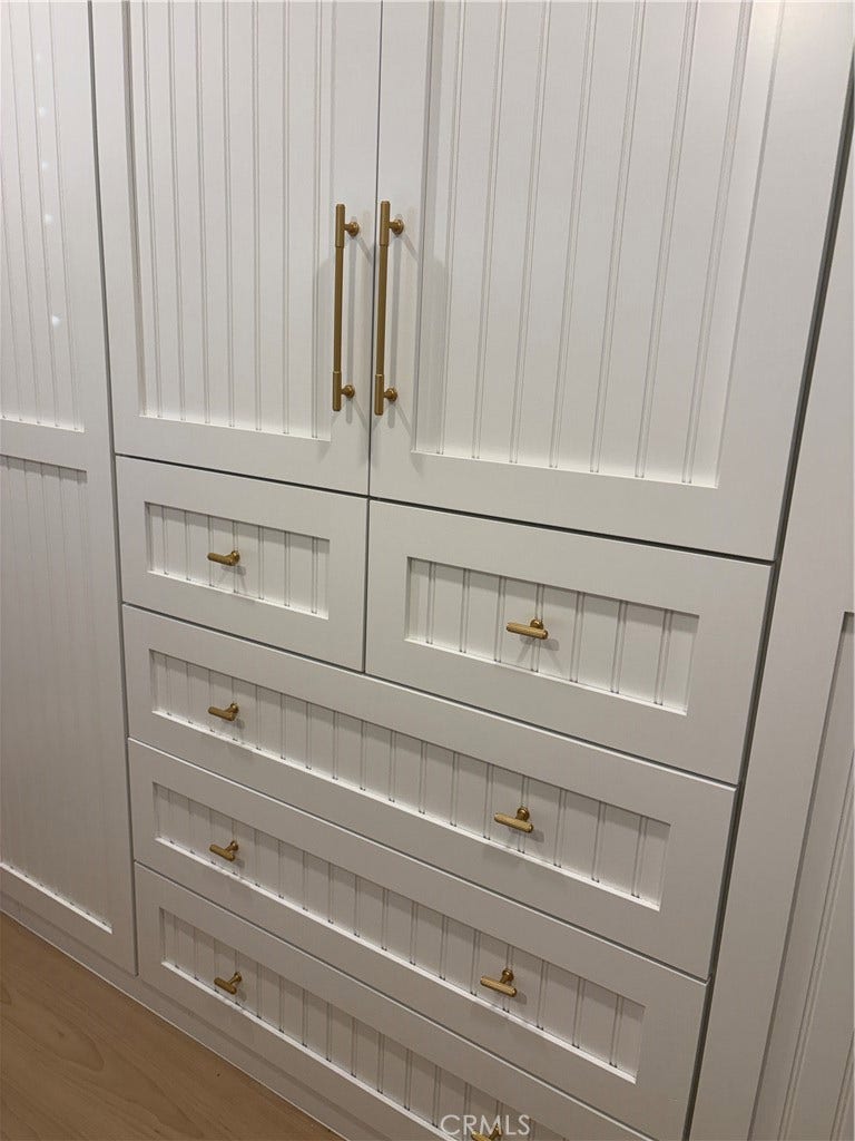 close up of drawers brass handles.