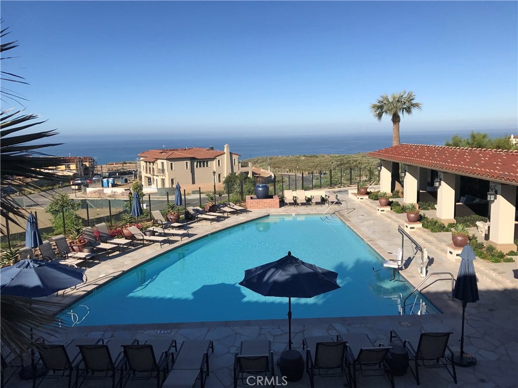 Resort like "Summit club" featuring beautiful clubhouse with catering kitchen-private cabanas-gym-loggia with fireplace-outdoor firepits all overlooking the Pacific ocean