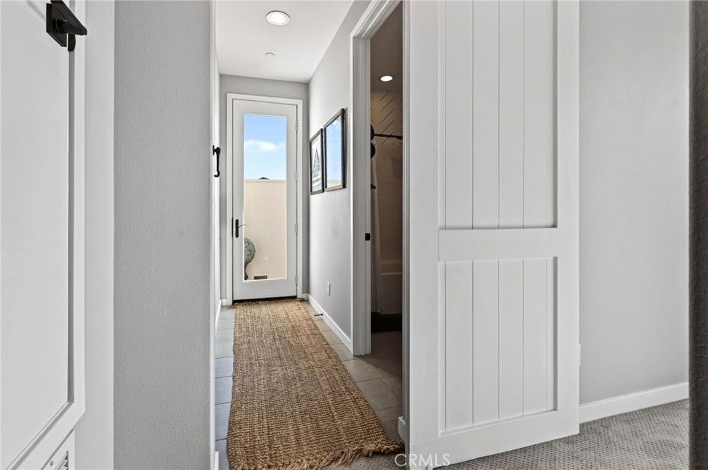 14 Marisol, Rancho Mission Viejo, CA 92694 An upgraded Barn Door separates the area to the fourth bedroom and the entrance to the Rooftop Deck.