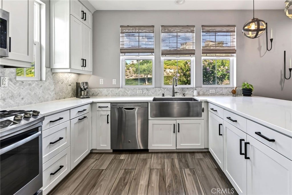 14 Marisol, Rancho Mission Viejo, CA 92694 The farm sink sits just below a wall of windows in this exceptional kitchen.