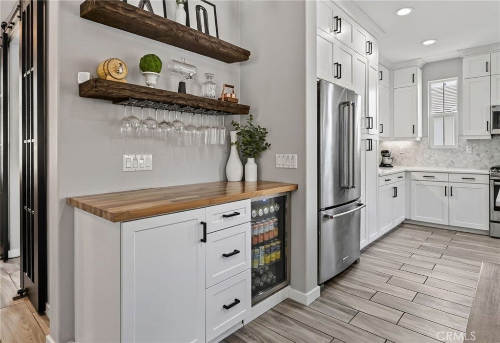 14 Marisol, Rancho Mission Viejo, CA 92694 Bulit in bar area with beverage cooler, wine rack, wooden shelving and lots of storage.