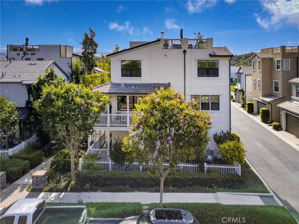 14 Marisol, Rancho Mission Viejo, CA 92694 This home has 3 outdoor areas! The downstairs yard with turf and lemon trees. The wraparound porch on the second level. The amazing rooftop deck with views of the hills & neighborhood.