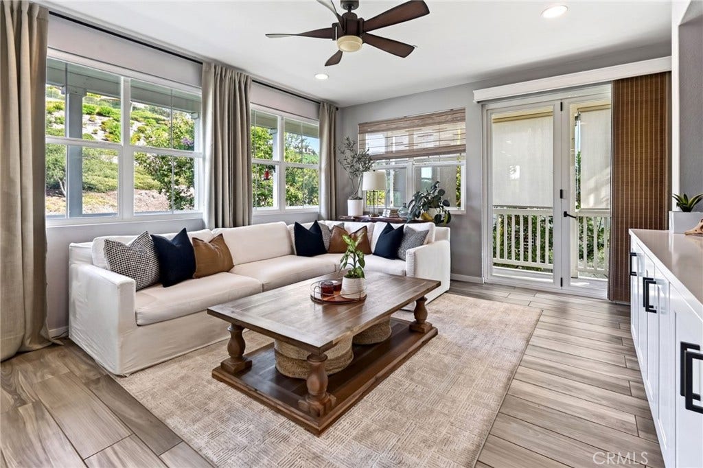 14 Marisol, Rancho Mission Viejo, CA 92694 The family room has beautiful has luxury vinyl tile and designer window coverings.