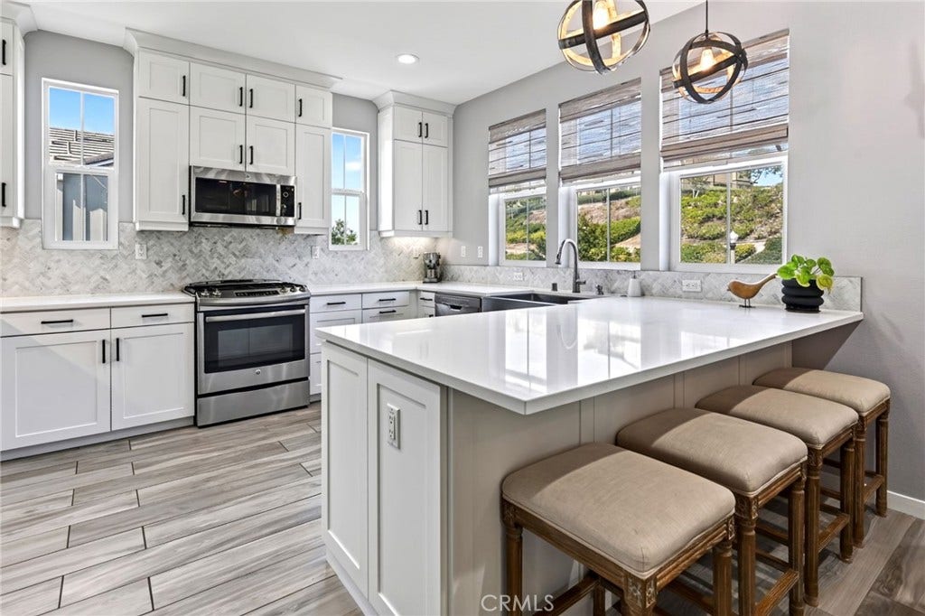 14 Marisol, Rancho Mission Viejo, CA 92694 Gorgeous kitchen with dining bar. The cabinets have storage to goes the the ceiling.