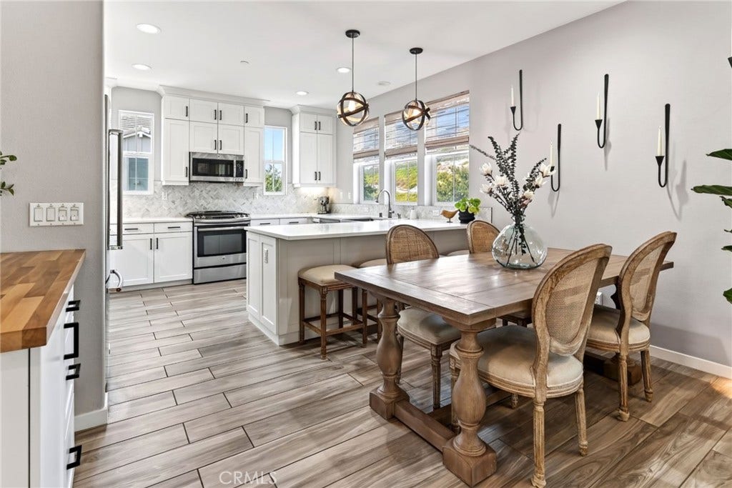 14 Marisol, Rancho Mission Viejo, CA 92694 The kitchen and dining area. To the left is the built in dry bar.