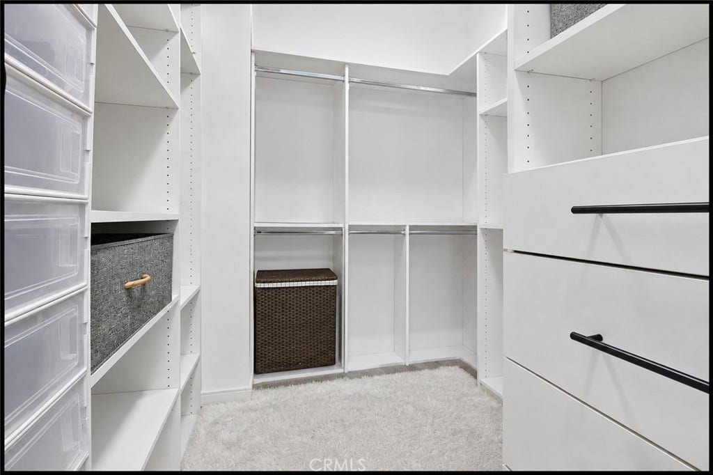 14 Marisol, Rancho Mission Viejo, CA 92694 Primary Bedroom has a huge walk in closet with bins, bars, & organization drawers (AI tools used to show it empty)