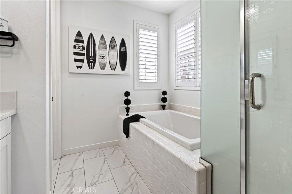 14 Marisol, Rancho Mission Viejo, CA 92694 The Primary Bathroom has a large soaking tub and separate shower with frosted privacy doors.