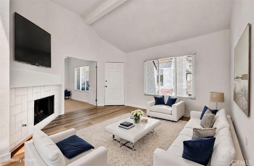 22 Aruba, Laguna Niguel, CA 92677 Light-filled living room with vaulted ceilings, featuring virtual staging.