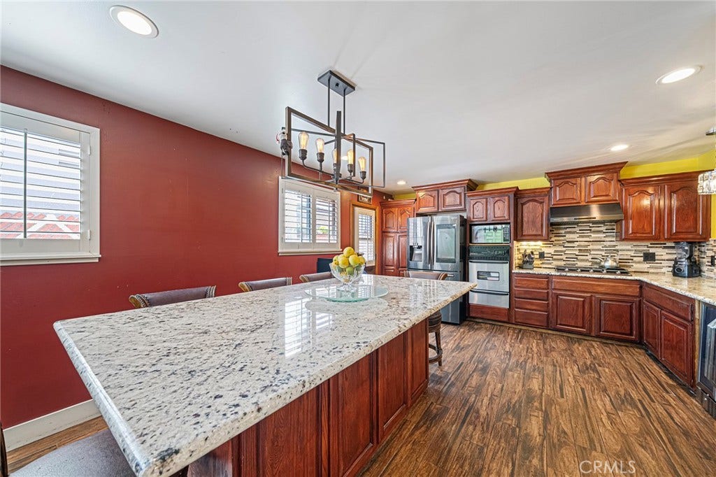 656 Sandy Hook, La Puente, CA 91744 Here is the custom island/table which can easily seat 8 or more...
