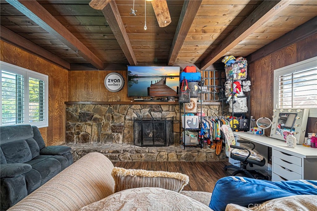 656 Sandy Hook, La Puente, CA 91744 Living room with wood ceilings and large fireplace...