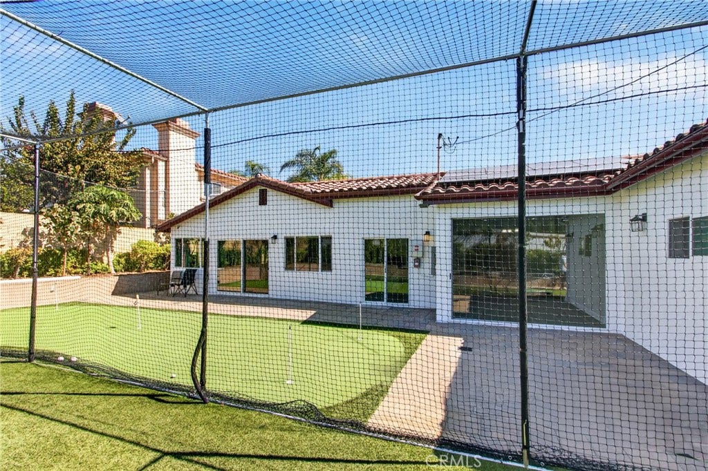 5451 Lockhaven Drive, Buena Park, CA 90621 Batting practice cage with netting and turf, located in the backyard.