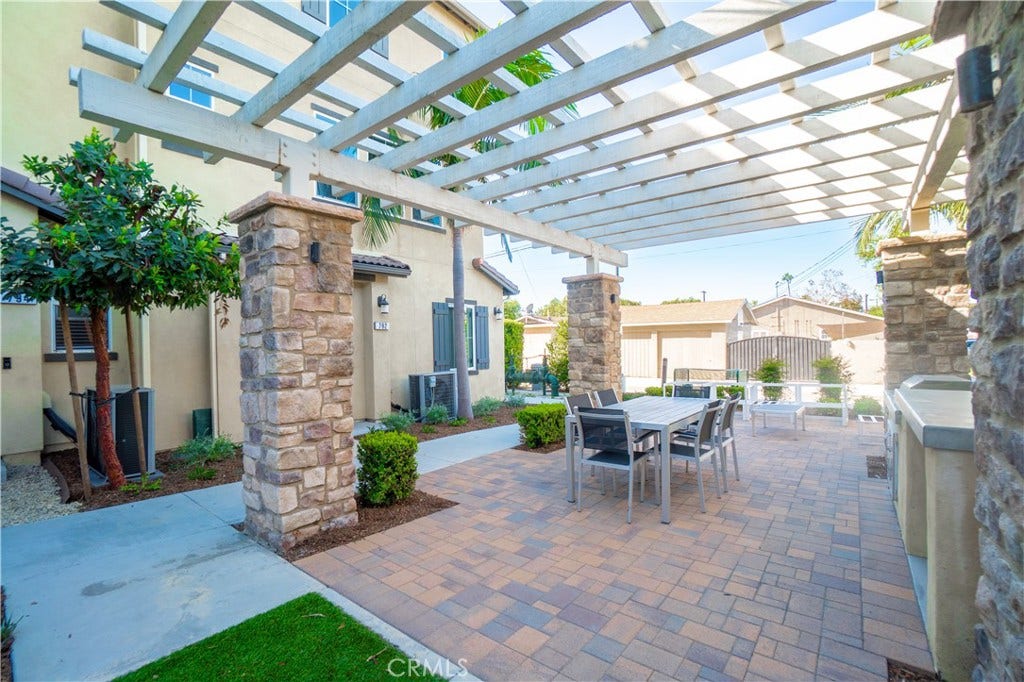 Community courtyard with pergola and seating