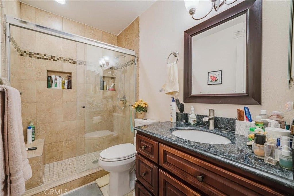 Remodeled primary bathroom with walk-in shower