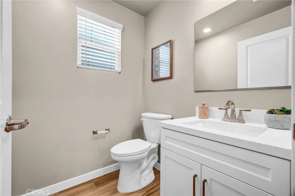 model home- half bath off great room