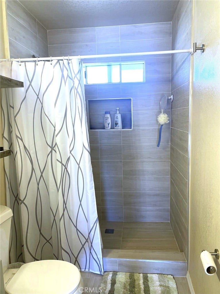 Updated walk in Shower with large ceramic tiles