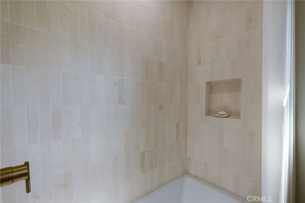 13235 Hindry, Hawthorne, CA 90250 Limestone shower tiles