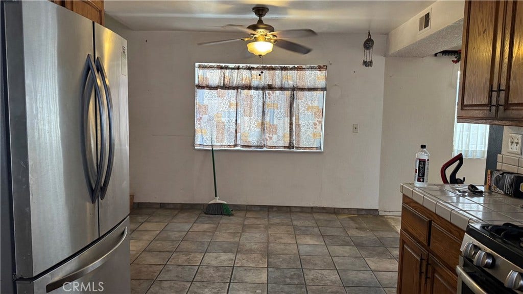Kitchen to dining/pass through to rear of home
