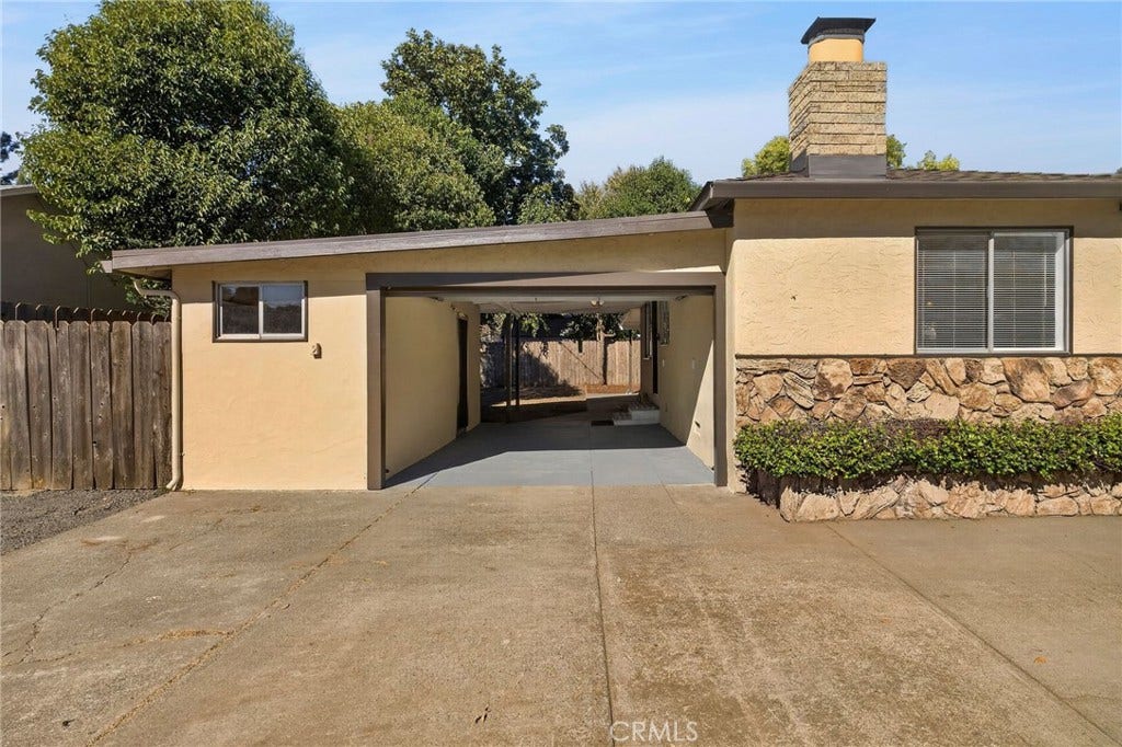 Entrance to garage area with automatic garage door opener