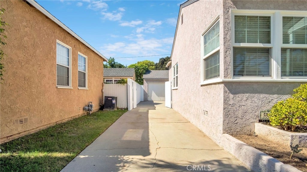 5503 Hayter, Lakewood, CA 90712 Long Driveway leading to garage, plenty of parking.