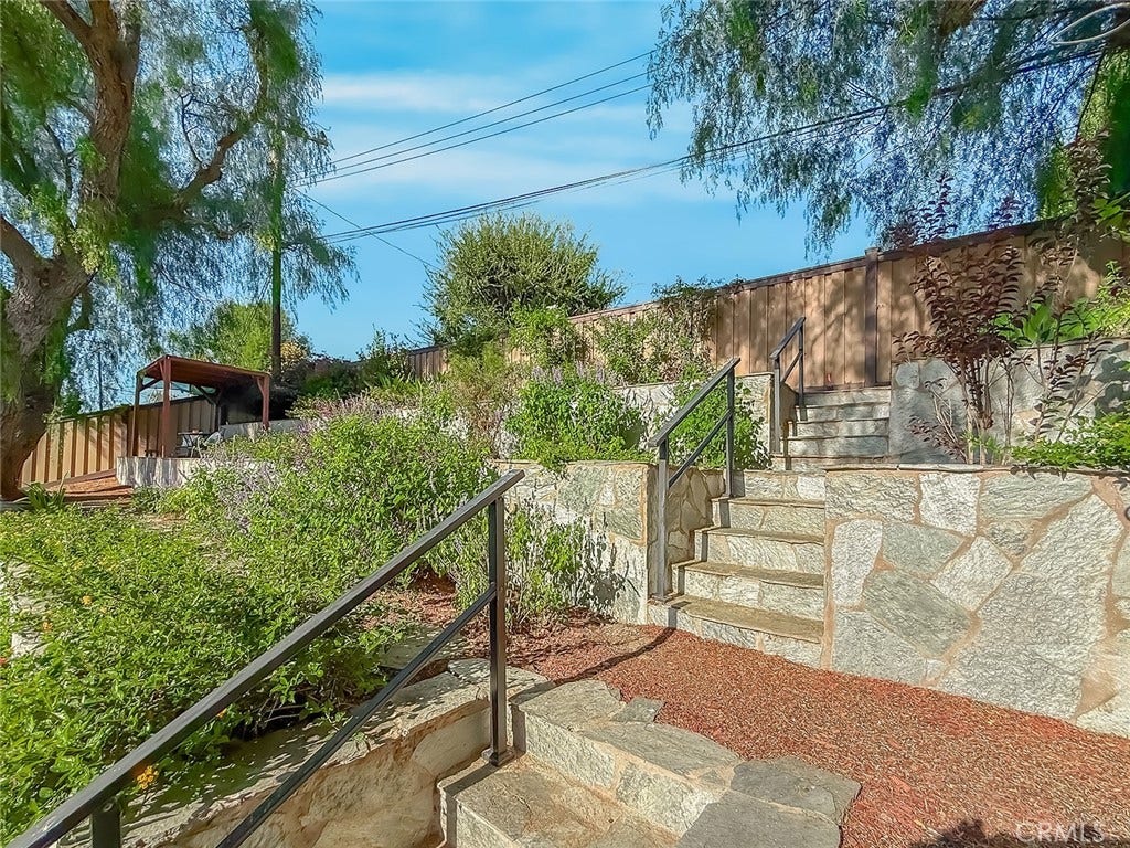 743 Spalding Street, Thousand Oaks, CA 91360 Stone stairways lead you to levels of landscaped backyard