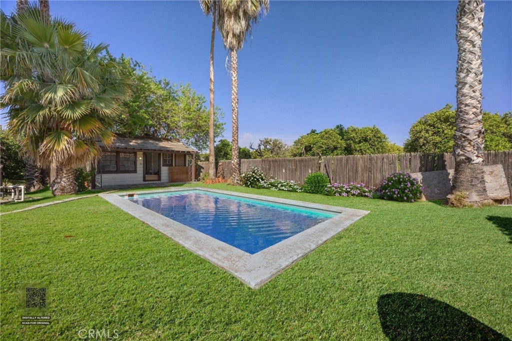 552 Pepper, Bakersfield, CA 93307 Digitally staged with water and greener grass