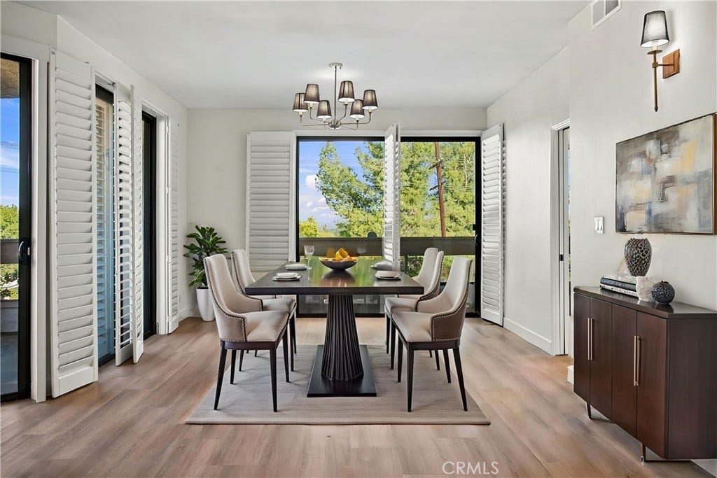 virtually staged/dining area off of living room