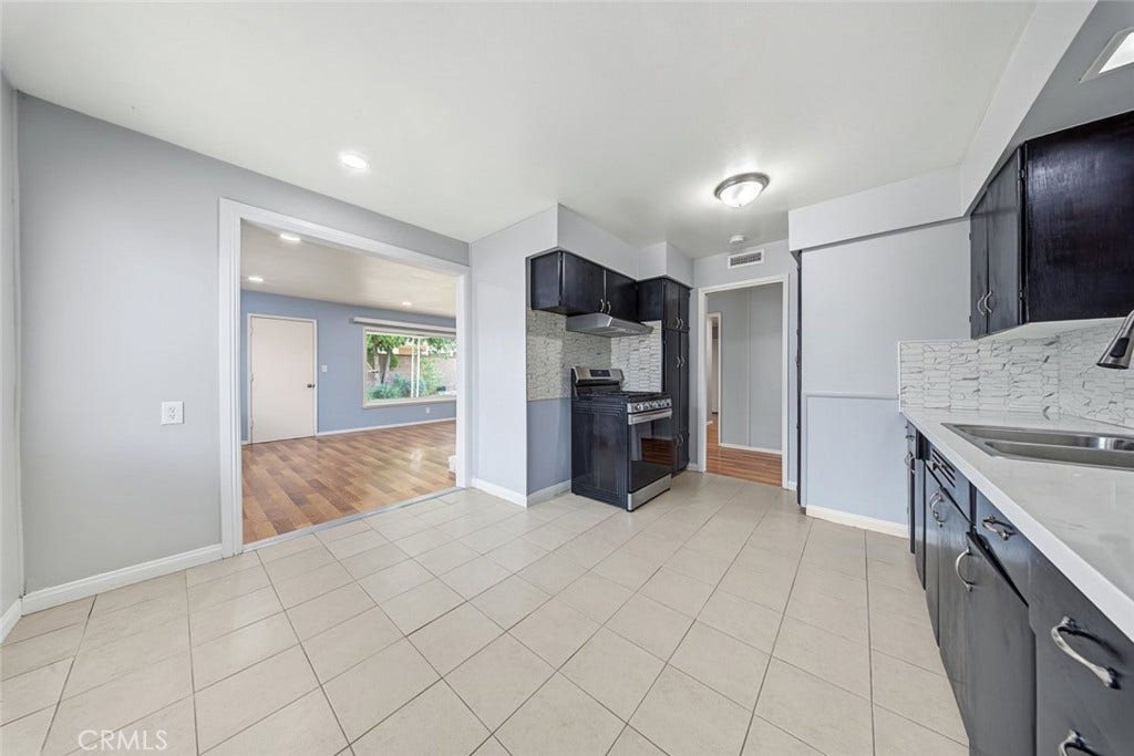 44650 2nd Street E, Lancaster, CA 93535 Kitchen is wide with plenty of space ton extend cabinetry - Quartz counters.