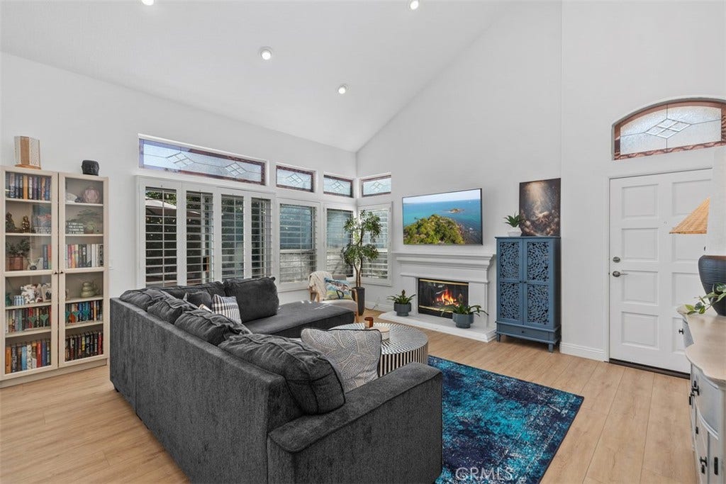 21121 Cancun, Mission Viejo, CA 92692 Luxurious Open Living Room. W/ Fireplace. Plantation Shutters