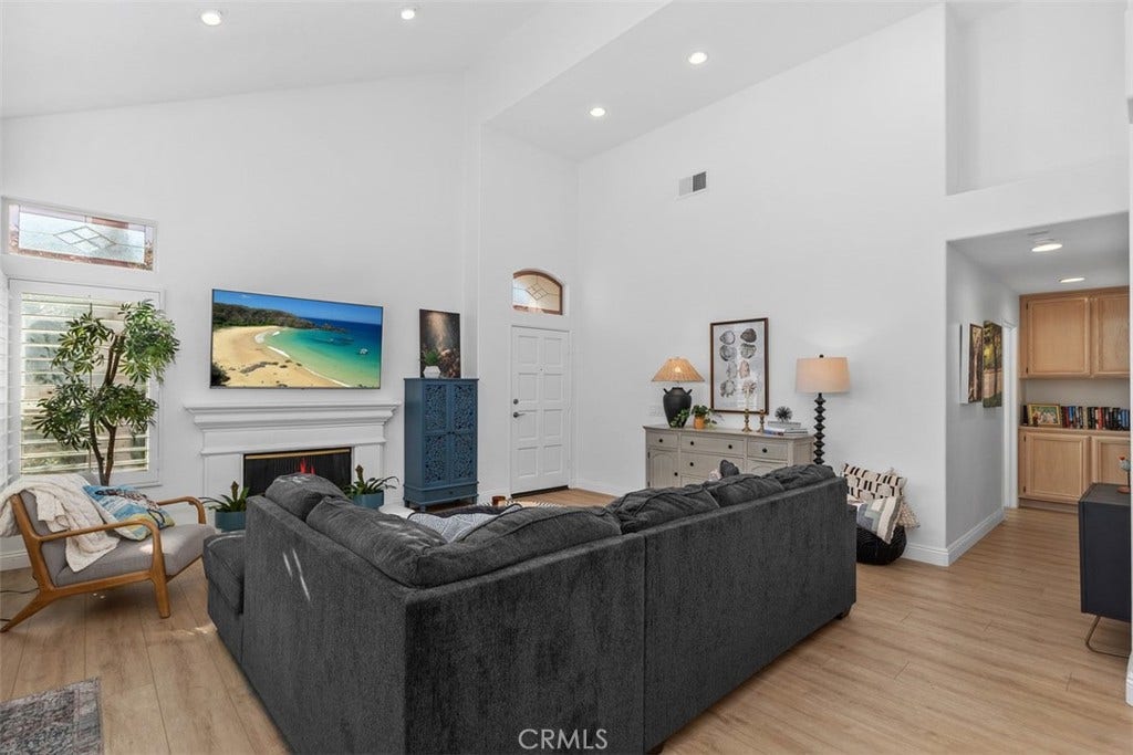 21121 Cancun, Mission Viejo, CA 92692 Luxurious Open Living Room. W/ Fireplace. Plantation Shutters