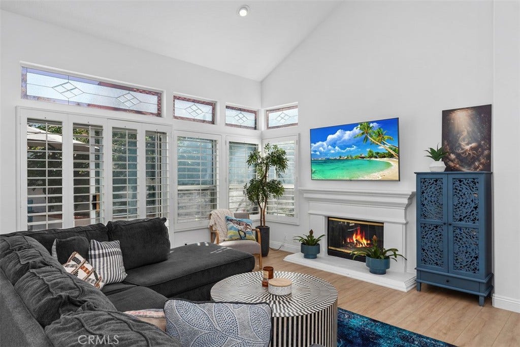 21121 Cancun, Mission Viejo, CA 92692 Luxurious Open Living Room. W/ Fireplace. Plantation Shutters