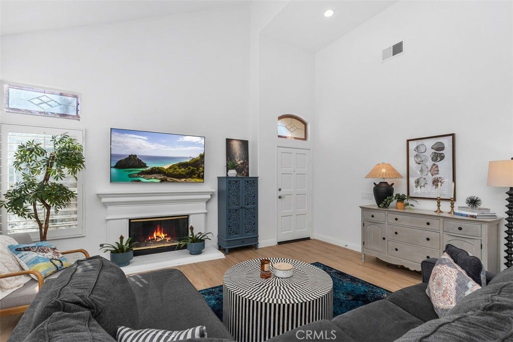 21121 Cancun, Mission Viejo, CA 92692 Luxurious Open Living Room. W/ Fireplace. Plantation Shutters