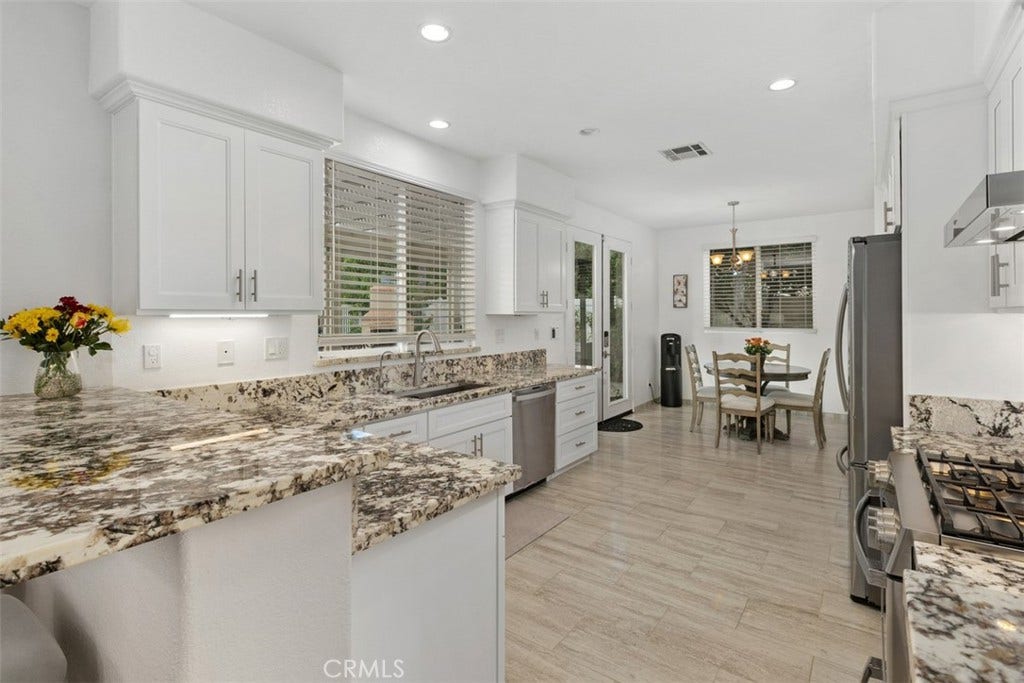 You will love this upgraded kitchen in soothing earth tones