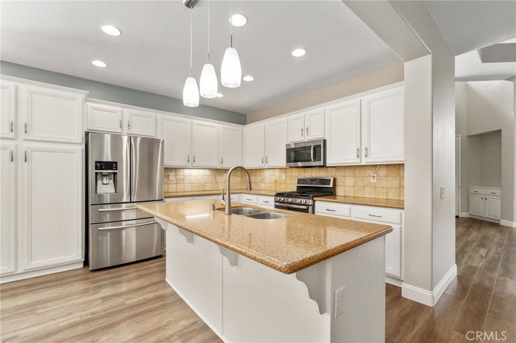 32440 Magenta Court, Temecula, CA 92592 Another View Of The Beautiful Kitchen Showcasing The Generous Center Island With Breakfast Bar, Stainless Steel Appliances, Attractive Countertops, And Abundant Cabinet Space.