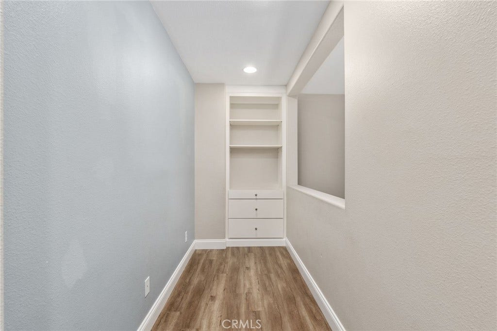 32440 Magenta Court, Temecula, CA 92592 Versatile Upstairs Nook Featuring Built-In Shelving And Cabinetry, Wood-Look Flooring, And A Convenient Space For A Home Office Or Study Area.
