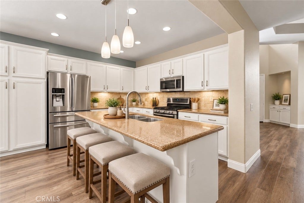32440 Magenta Court, Temecula, CA 92592 Another View Of The Beautiful Kitchen Showcasing The Generous Center Island With Breakfast Bar Seating, Stainless Steel Appliances, Attractive Countertops, And Abundant Cabinet Space. Digitally Staged