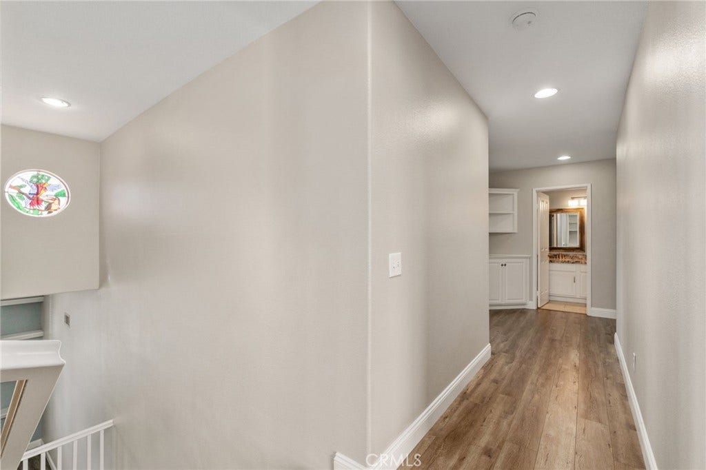 32440 Magenta Court, Temecula, CA 92592 Spacious Upstairs Hallway Featuring Wood-Look Flooring, Recessed Lighting, And An Open View Overlooking The Staircase.