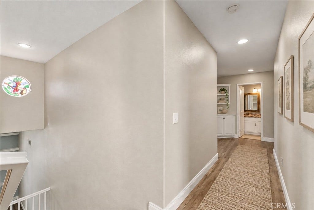 32440 Magenta Court, Temecula, CA 92592 Spacious Upstairs Hallway Featuring Wood-Look Flooring, Recessed Lighting, And An Open View Overlooking The Staircase. Digitally Staged
