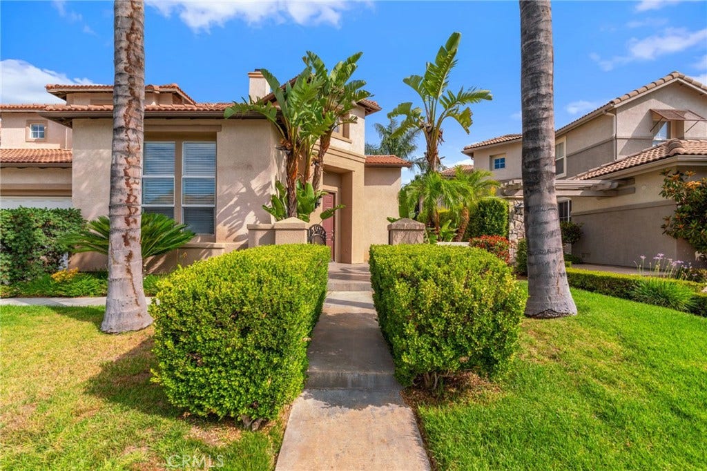 32440 Magenta Court, Temecula, CA 92592 Welcoming Front Walkway Surrounded By Beautifully Maintained Hedges, Tropical Landscaping, And Mature Palm Trees.
