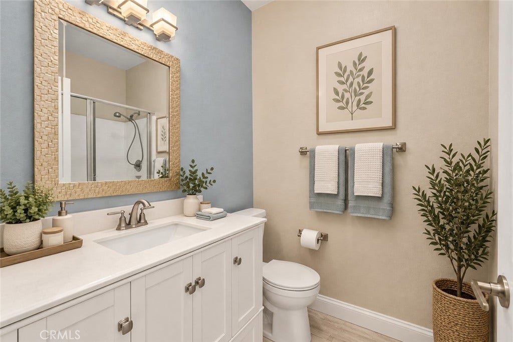 32440 Magenta Court, Temecula, CA 92592 Well-Appointed Bathroom Featuring A White Vanity, Framed Mirror, Tub And Shower Combination, And Attractive Accent Wall. Digitally Staged