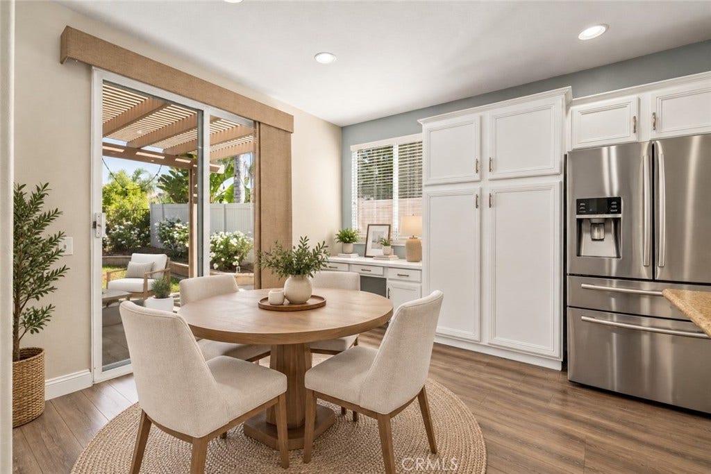 32440 Magenta Court, Temecula, CA 92592 Charming Dining Area Featuring Wood-Look Flooring, Abundant Natural Light, Sliding Glass Door Access To The Backyard, And A Convenient Built-In Desk Area. Digitally Staged