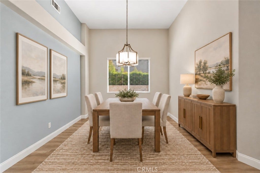32440 Magenta Court, Temecula, CA 92592 Elegant Formal Dining Room Featuring Soaring Ceilings, An Attractive Light Fixture, Wood-Look Flooring, And A Large Window Providing Natural Light. Digitally Staged