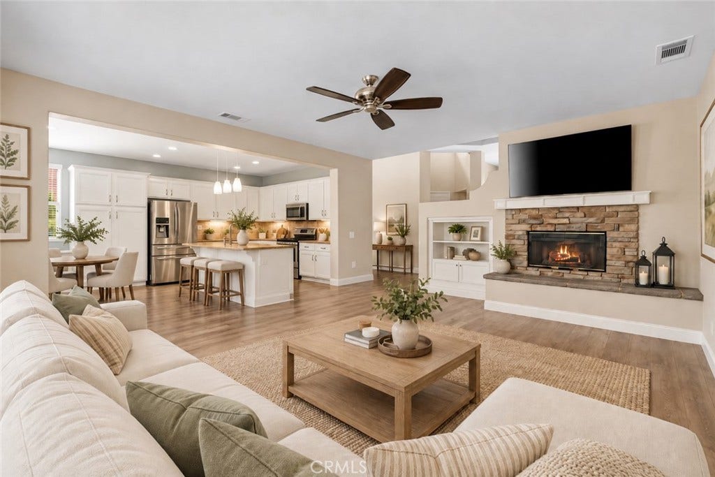 32440 Magenta Court, Temecula, CA 92592 Beautiful Open-Concept Family Room Featuring A Stone-Surround Fireplace, Built-In Shelving, And A Seamless Connection To The Spacious Kitchen And Dining Area. Digitally Staged