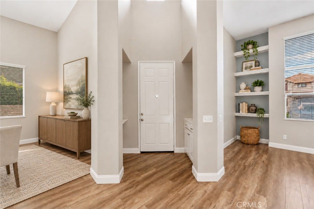 32440 Magenta Court, Temecula, CA 92592 Bright And Inviting Entryway Featuring Soaring Ceilings, Attractive Wood-Look Flooring, And An Open View Of The Versatile Front Living Spaces. Digitally Staged