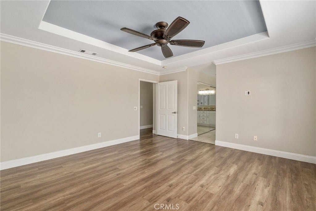 32440 Magenta Court, Temecula, CA 92592 Another View Of The Spacious Primary Suite Highlighting The Elegant Tray Ceiling, Generous Floor Space, And Convenient Access To The Private Primary Bathroom.