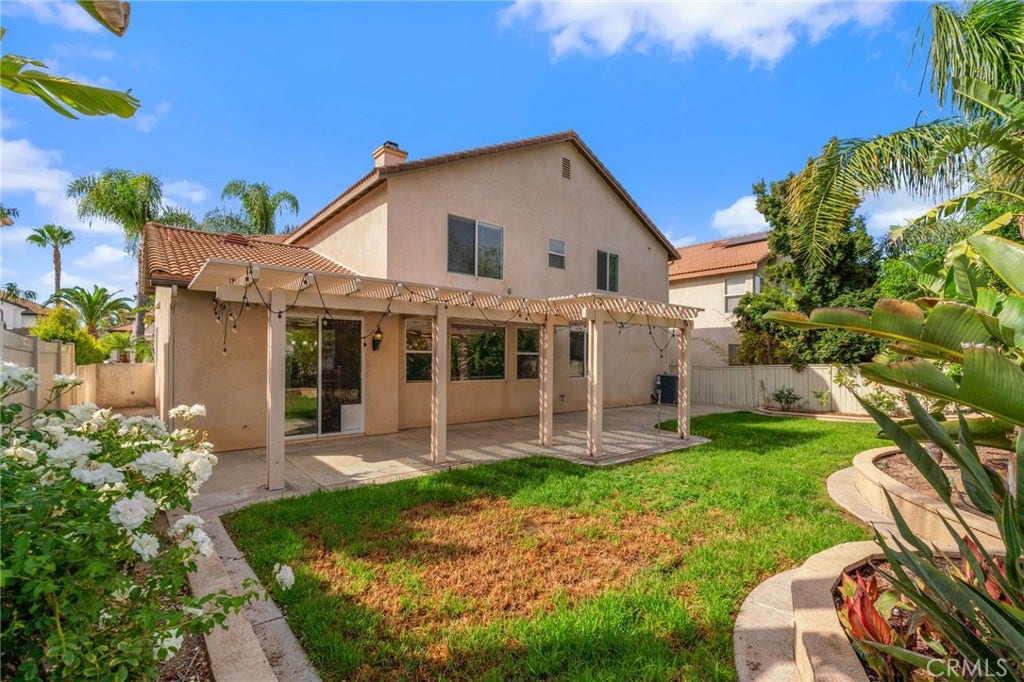 32440 Magenta Court, Temecula, CA 92592 Beautiful Backyard Featuring A Spacious Lawn, Expansive Pergola-Covered Patio, Mature Tropical Landscaping, And Plenty Of Room For Outdoor Enjoyment.