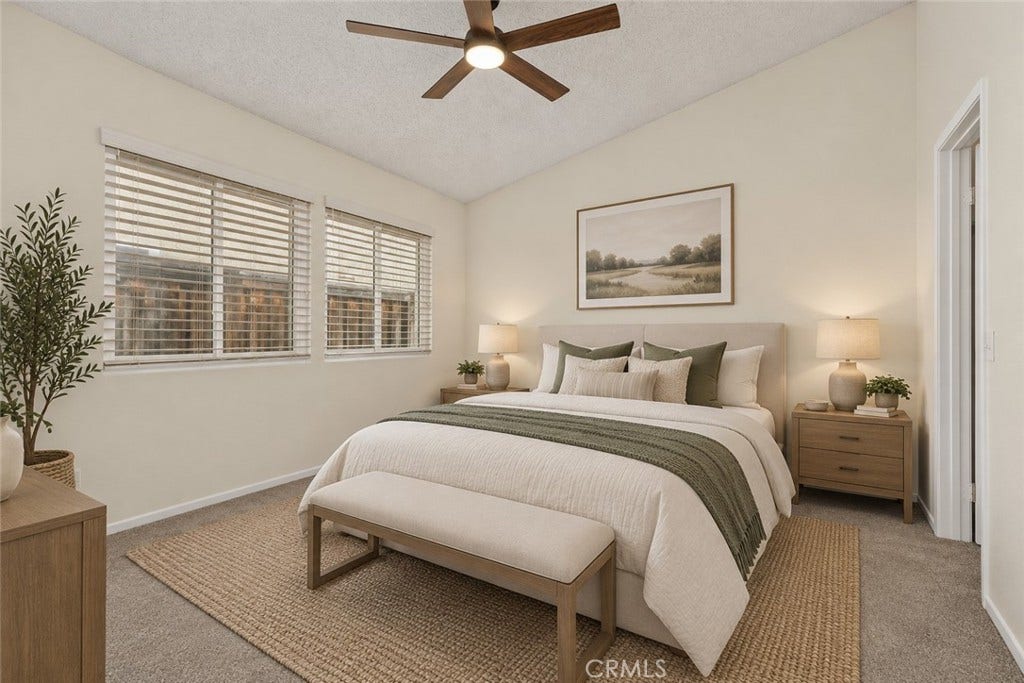 42329 Via Consuelo, Temecula, CA 92592 The comfortable primary bedroom features soft carpeting, a ceiling fan, and two windows providing natural light. Digitally Staged