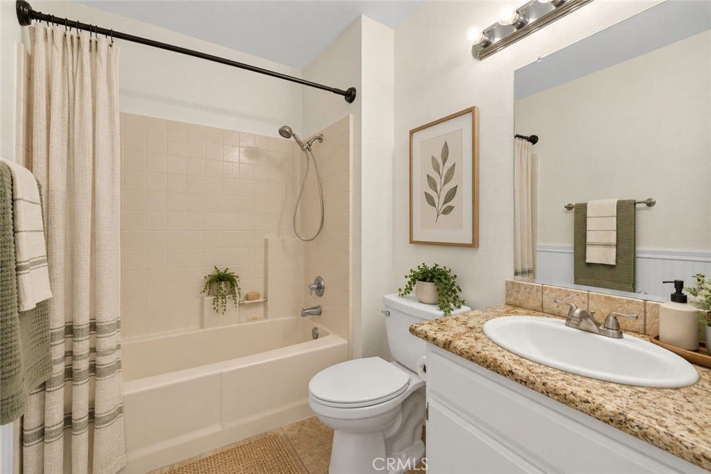 42329 Via Consuelo, Temecula, CA 92592 Additional full bathroom featuring a tub and shower combination, granite-topped vanity, and convenient storage. Digitally Staged
