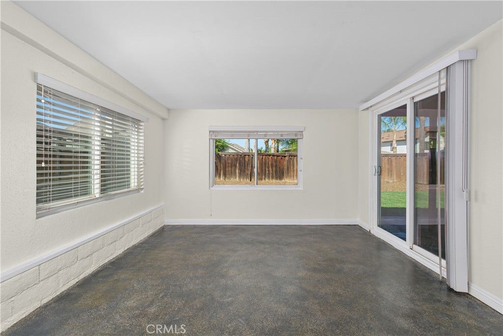 42329 Via Consuelo, Temecula, CA 92592 Versatile enclosed patio offering an inviting additional space to relax, with multiple windows and sliding glass doors overlooking the backyard.