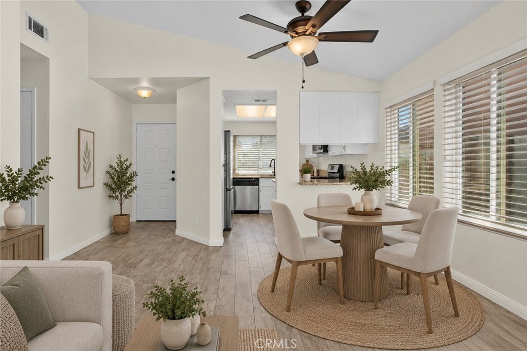 42329 Via Consuelo, Temecula, CA 92592 Dining area conveniently situated beside the kitchen, featuring a ceiling fan, large windows, and an open connection to the living space. Digitally Staged