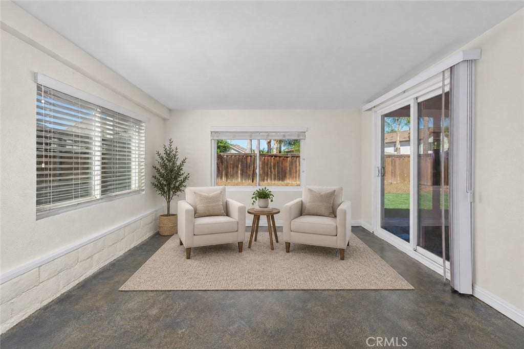 42329 Via Consuelo, Temecula, CA 92592 Versatile enclosed patio offering an inviting additional space to relax, with multiple windows and sliding glass doors overlooking the backyard. Digitally Staged